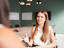 A woman receiving in person interview coaching.